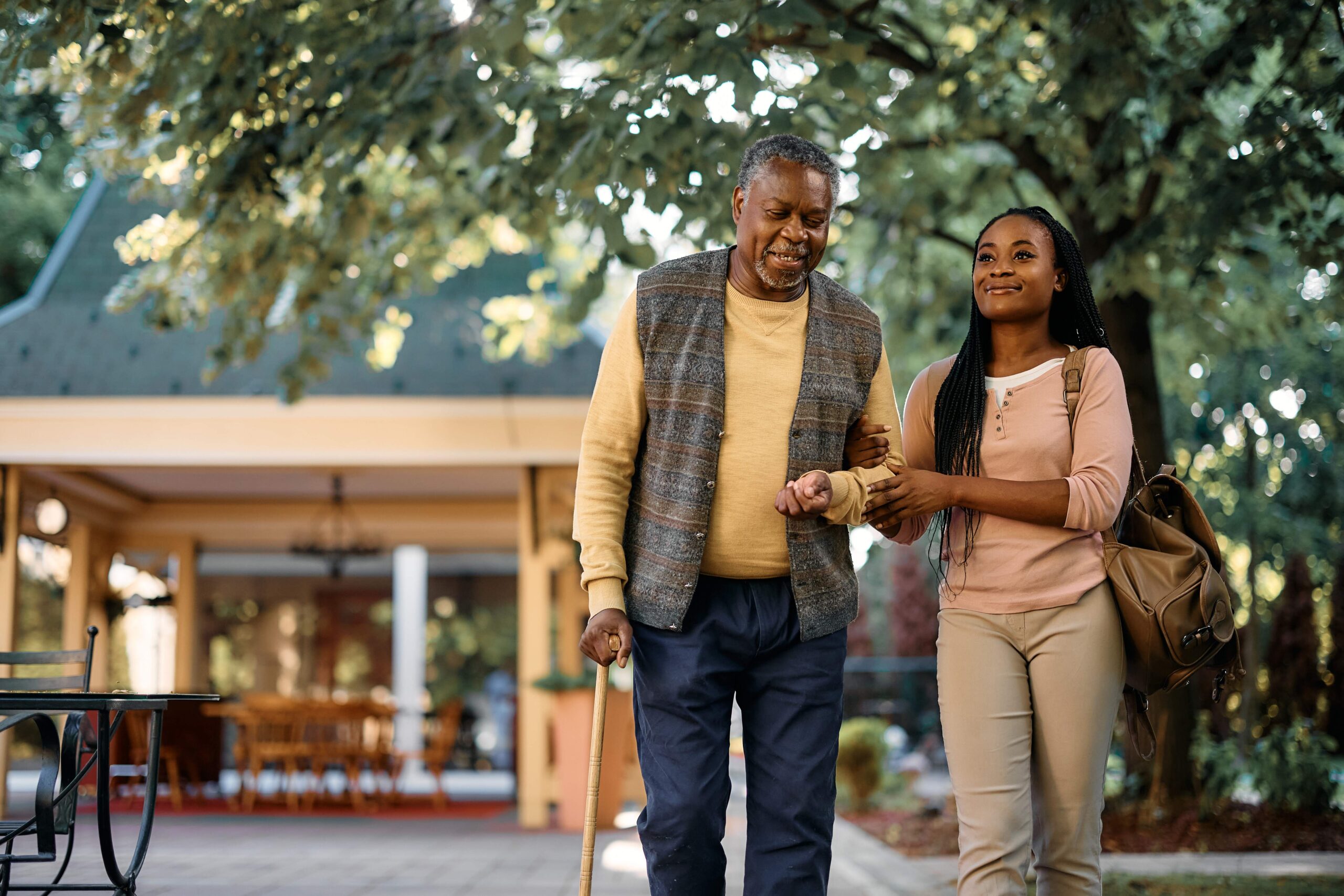 happy-black-woman-walking-with-senior